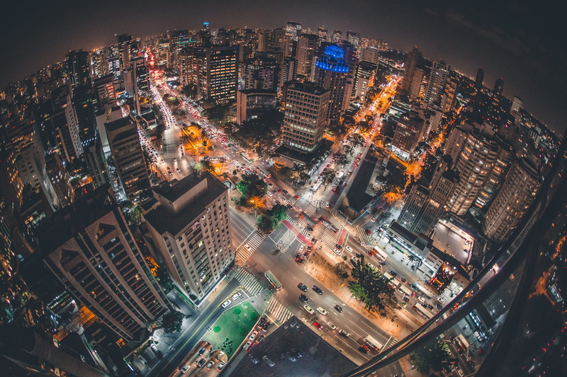 city street, crowded, city lights, buildings, illuminated, apartment, skyscrapers, city life, vehicles, outdoors, highway, office building exterior, high angle view
