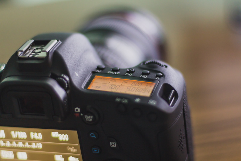 50mm, radio, push button, car, digital camera, indoors, depth of field, close-up, communication, 24-105mm, dial, no people, 5K, retro styled, focus on foreground