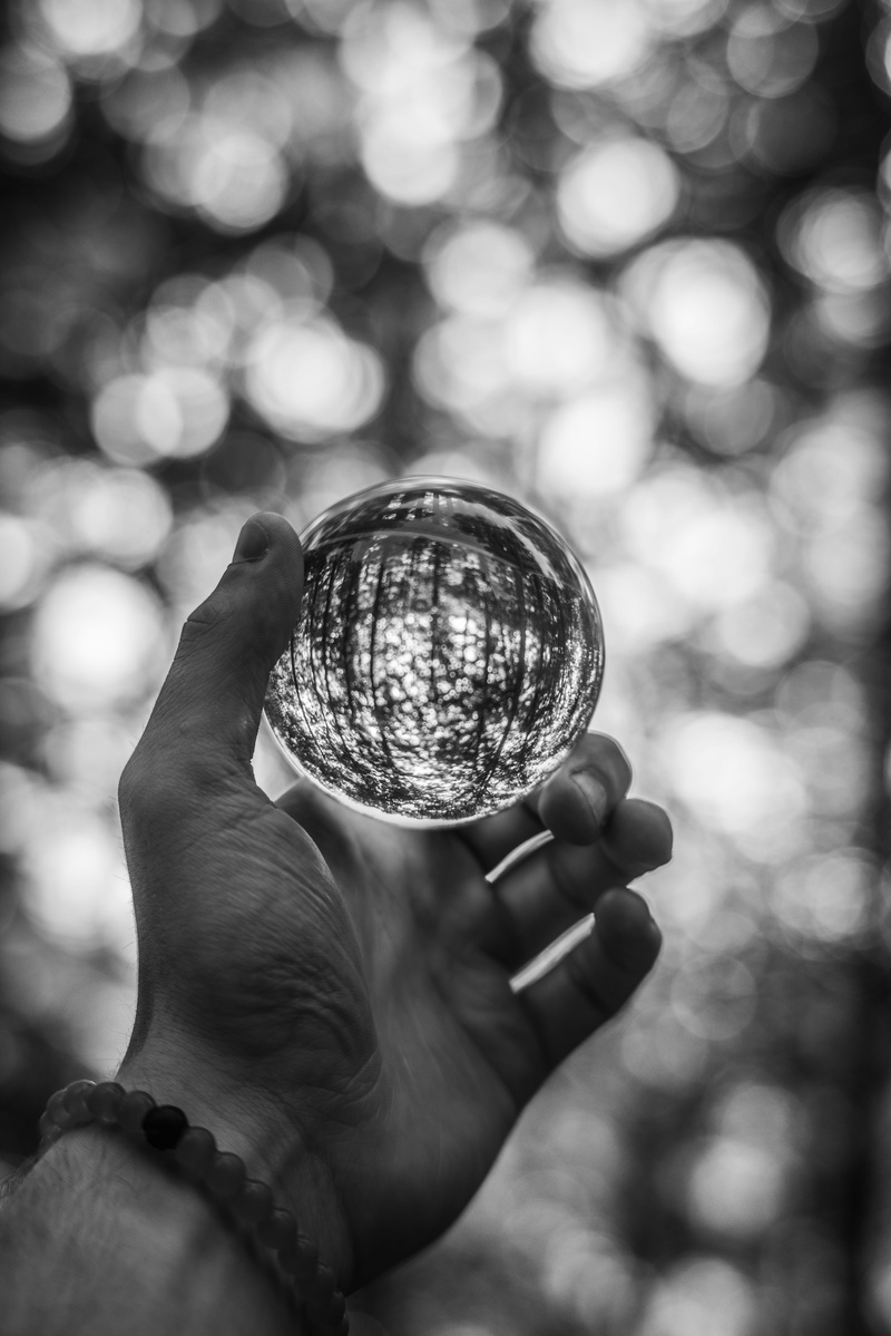 circles, crystal, outdoors, personal perspective, farmville, human body part, sony a7r, human limb, leisure activity, day, lake, finger, close-up, sphere