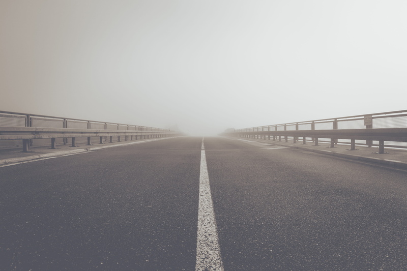 haze, road system, sky, long, direction, distant, road marking, marking, asphalt, central reservation, transit, no people, outdoors, symbol, road, crash barriers