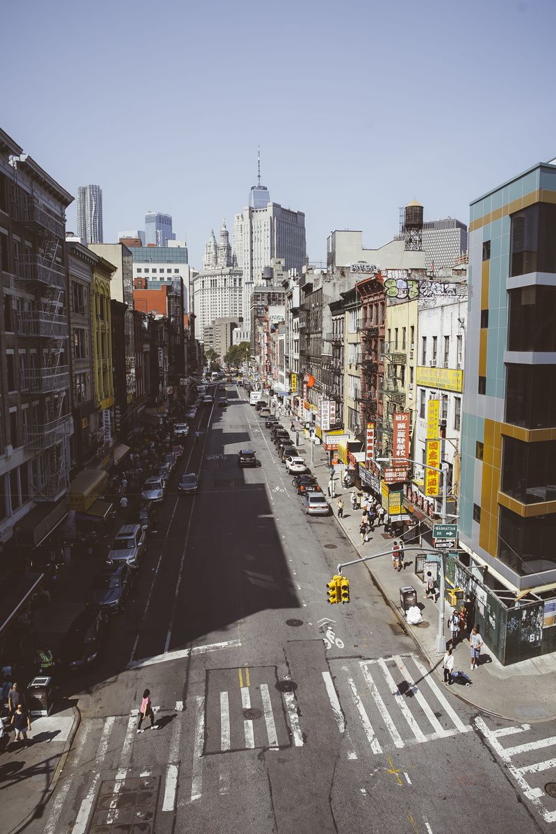 city, city street, new york city, building facade, office building exterior, nature, mode of transportation, signage, transportation, vehicle, person, busy