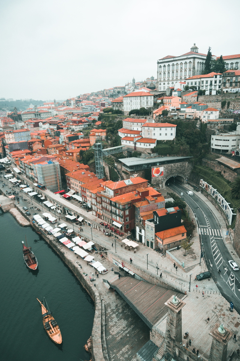 town, townscape, nautical vessel, mode of transportation, urban, sky, ship, built structure, watercrafts, building, residential district, view, waterfront