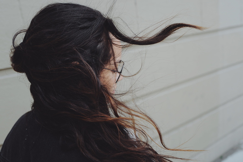 brown hair, getting, windy, black, eye, one person, young women, human face, young adult, head, near, profile view, close-up, city, woman, glasses, girl