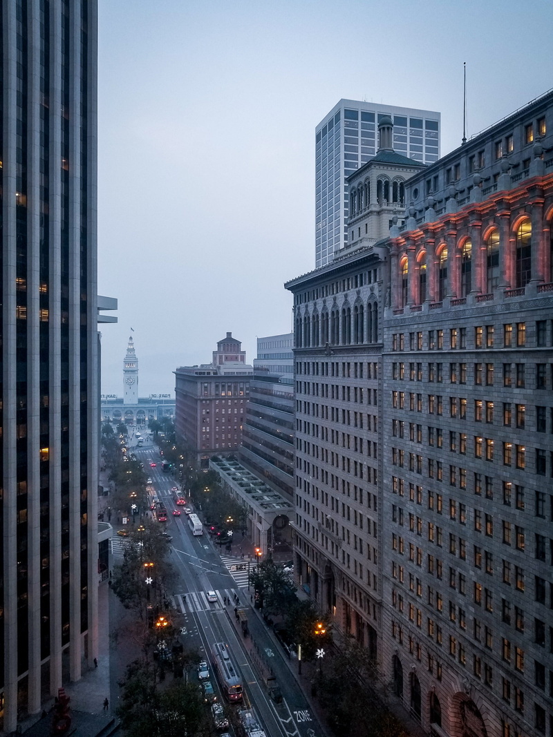 office building exterior, motor vehicle, building, ferry building, outdoors, transportation, building exterior, road, intersection, car, nature, 2K, no people
