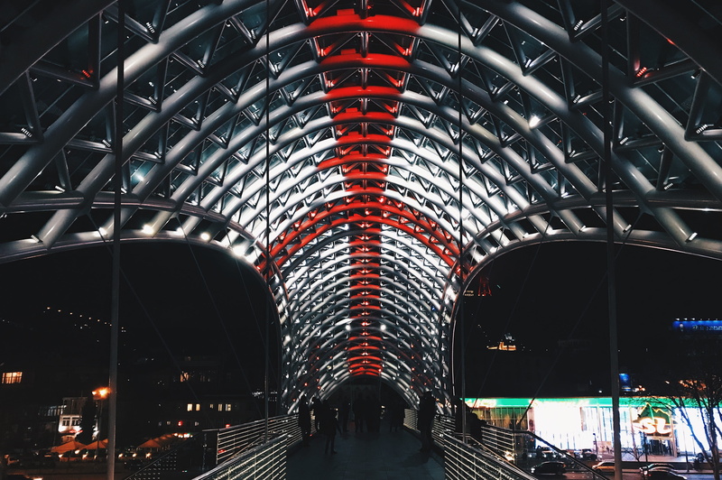 illuminated, real people, built structure, georgia, group of people, bridge, mode of transportation, indoors, city, architecture, modern, tbilisi, travel destinations