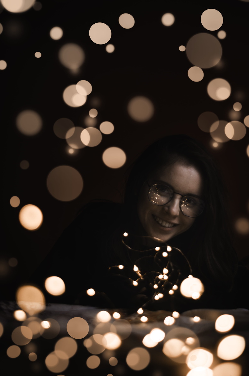 glowing, 4K, wearing, light - natural phenomenon, headshot, light, vigil, flower, finger, black, framed, young women, shirt, indoors, bokeh, flame, woman
