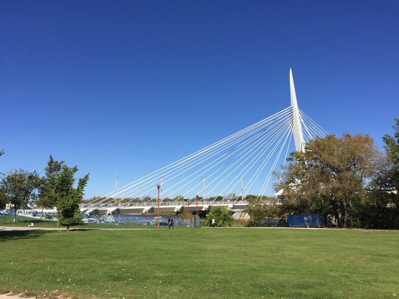 architecture, field, 2K, city, cable-stayed bridge, park, incidental people, modern, built structure, green color, grass, outdoors, canada, Winnipeg, tree