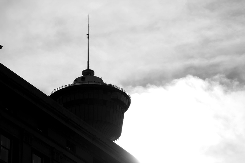 tourism, built structure, calgary tower, history, day, outdoors, black and white, low angle view, architecture, spire, building exterior, communication