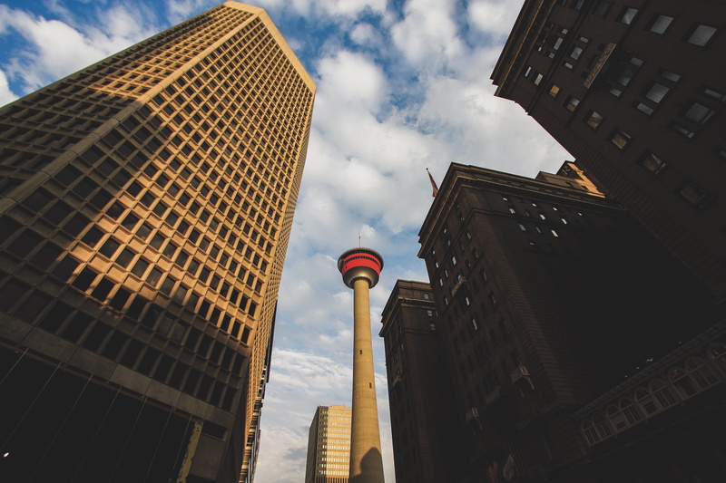 shadows, day, office building exterior, built structure, building exterior, outdoors, tower, sunset, office, blue, financial district, sky, cityscape, calgary