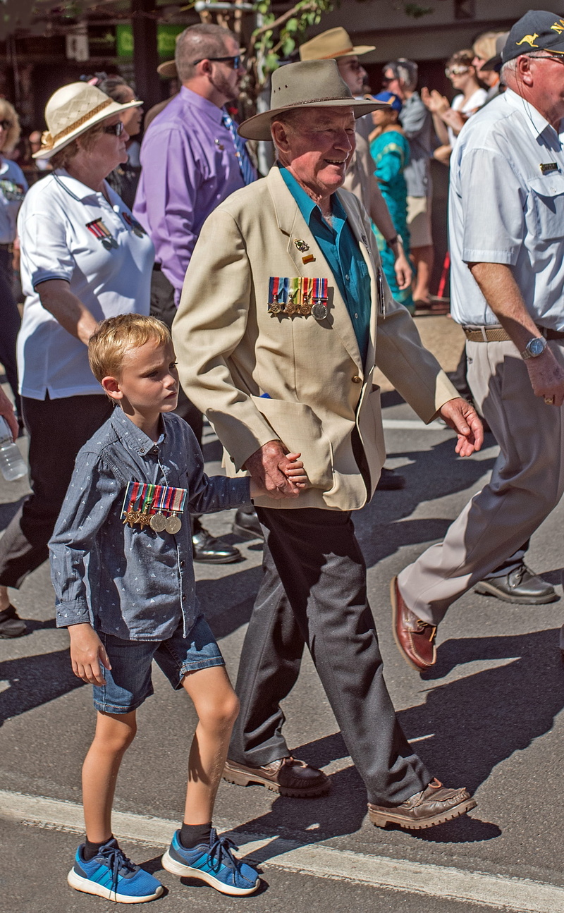 esplanade, medals, street, full length, outdoors, lifestyles, parade, sunlight, togetherness, men, child, old, procession, cairns city, boys, family, 2K