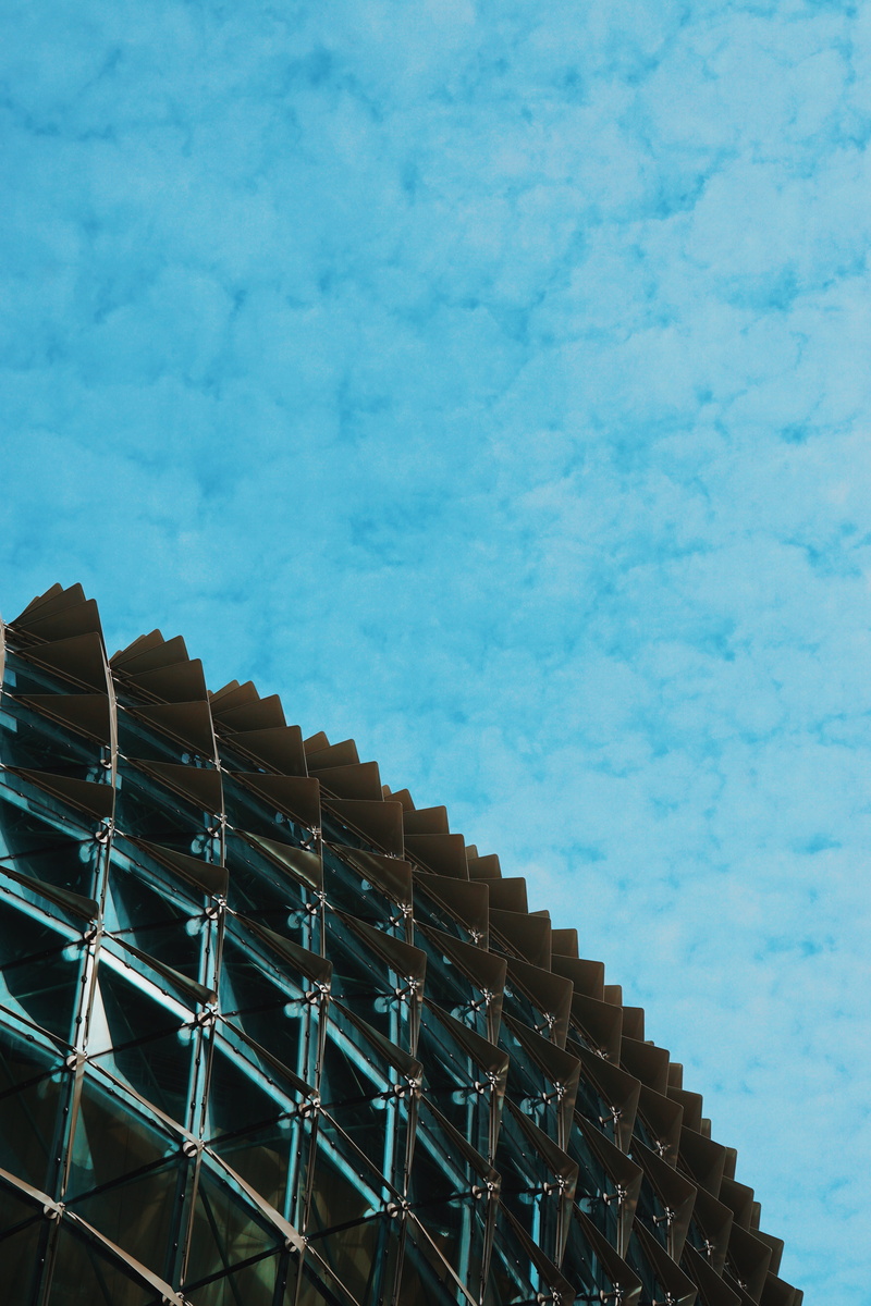 low angle view, cloud - sky, high section, modern, built structure, day, nature, blue, copy space, city, pattern, sky, building, no people, landscape, residential district