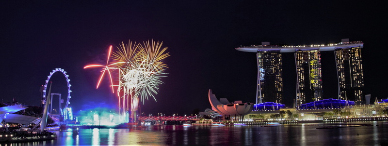 building exterior, motion, illuminated, celebration, flyer, sky, new years eve, arts culture and entertainment, reflection, 5K, firework, singapore, water