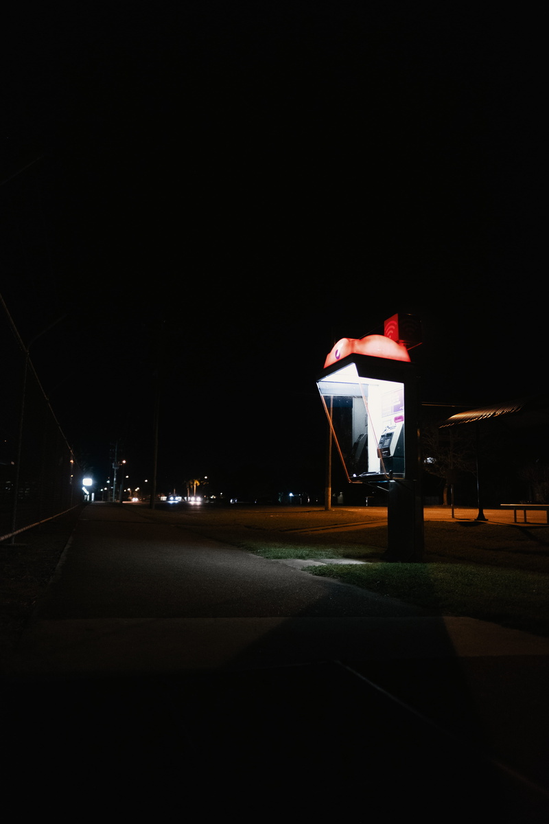 motor vehicle, mode of transportation, building exterior, building, road, dark, night sky, copy space, lighting equipment, architecture, night light, transportation
