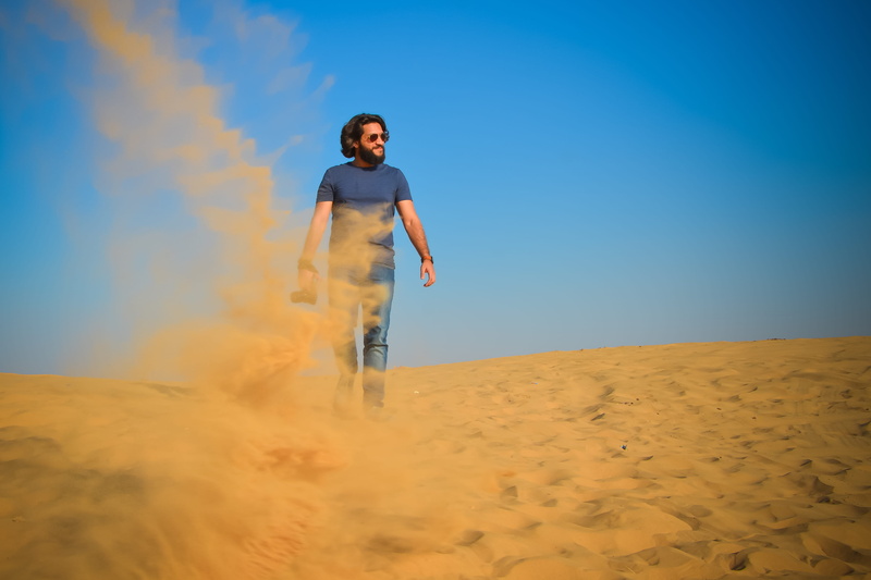 arid climate, land, sand dune, one person, adult, india, sky, camera, nature, rajasthan, osian, jodhpur, desert, lifestyles, sand, blue, real people, landscape