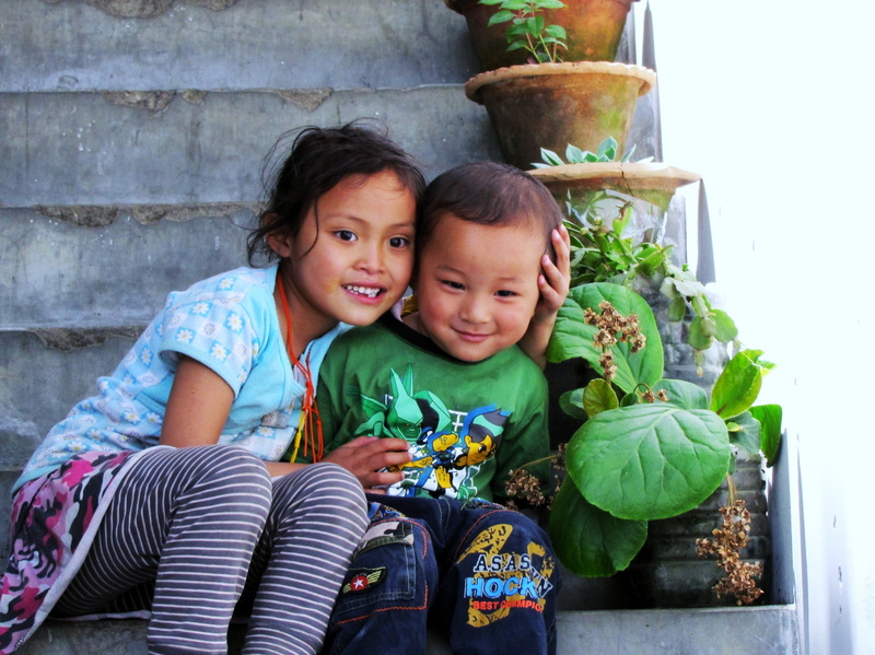girl, paro valley, lifestyles, 2K, family, staircase, togetherness, children, mid adult, sitting, outdoors, mother, people, real people, beside, looking at camera