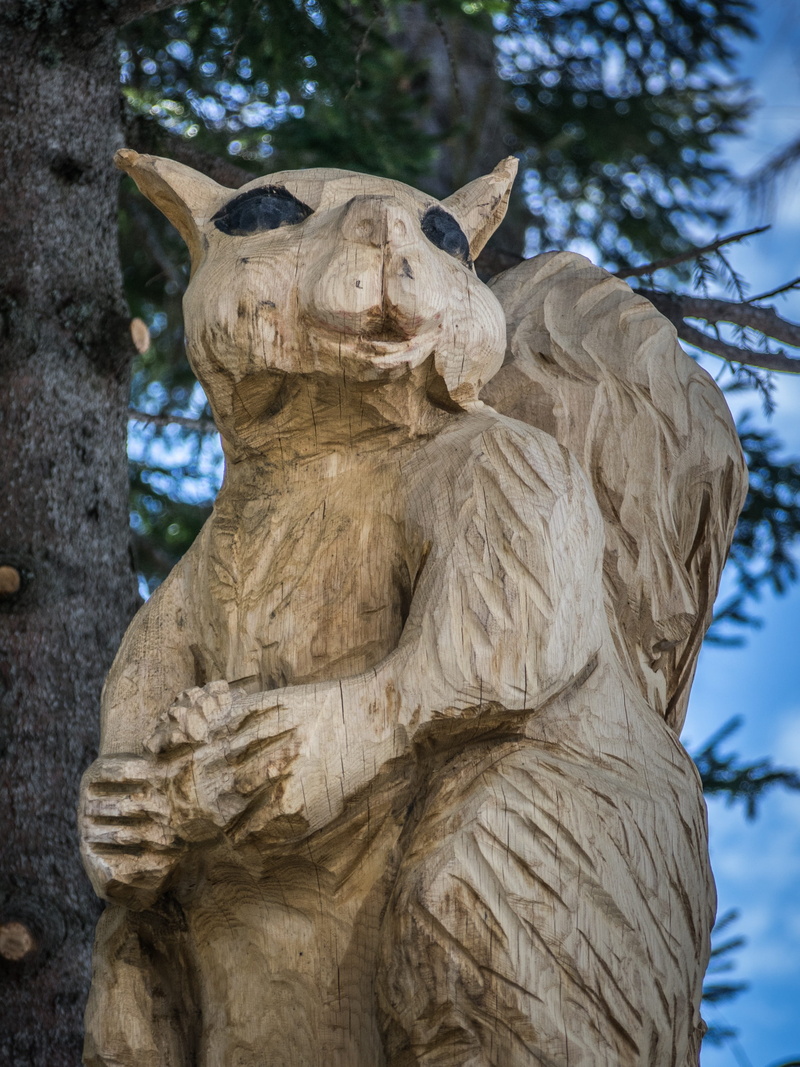 animal representation, focus on foreground, day, nature, animal wildlife, statue, tree, animal themes, mammal, no people, sculpture, wooden sculpture, art