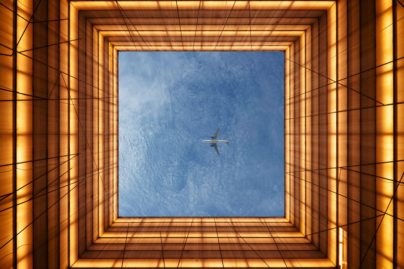 directly below, built structure, cloud - sky, office building exterior, low angle view, mid-air, mode of transportation, 2K, construction site, sky, flying