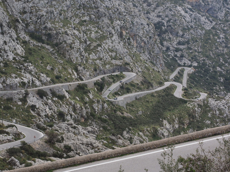mallorca, karst area, outdoors, beauty in nature, day, railing, high angle view, spain, tranquil scene, hairpin bends, pass road, environment, non-urban scene