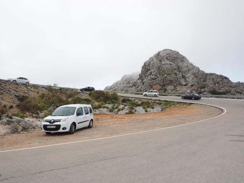 land vehicle, pass road, copy space, transportation, rock, mode of transportation, coll dels rice, road trip, karst area, gorge, travel, nature, beauty in nature