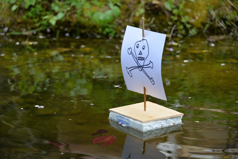pirate, body, children, day, information, tree, sailing boat, focus on foreground, nature, pond, plant, waterfront, explore, number, joy, sign, toy, tranquility