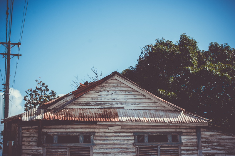 low angle view, residential district, day, building exterior, building, no people, urban, clear sky, tinroof, makeshift, nature, plant, dominicanrepublic