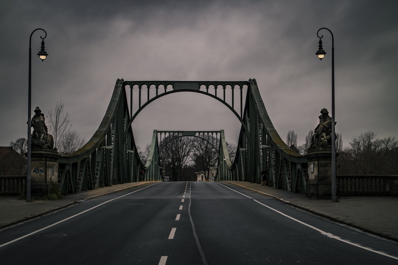 architecture, lighting equipment, direction, cloud - sky, marking, bridge, outdoors, street, 2K, street light, diminishing perspective, transportation