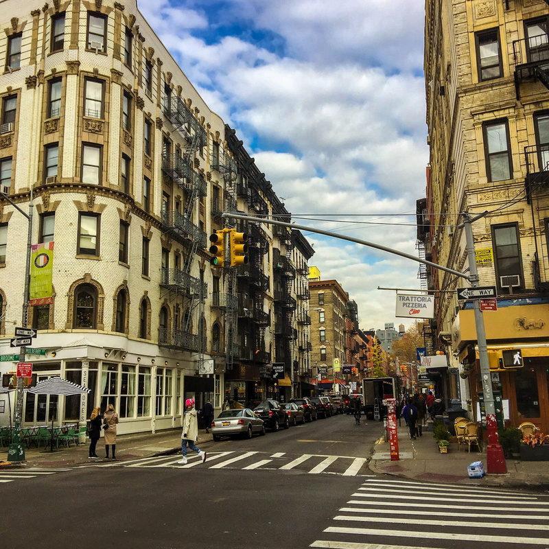 road marking, built structure, road, city street, transportation, incidental people, cloud - sky, building exterior, tourism, new york city, little italy