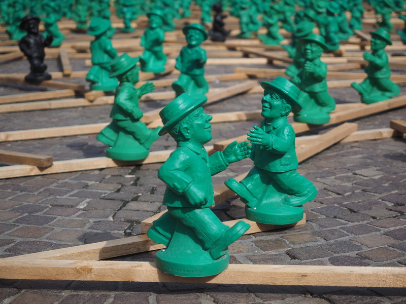 places of interest, turquoise colored, no people, little green man, a symbol of unity, figurine, high angle view, unit male characters, large group of objects