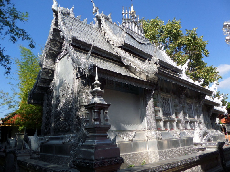 sculpture, buddhism, tree, belief, silvered, temptation, sky, building, low angle view, day, building exterior, place of worship, chiangmai, built structure
