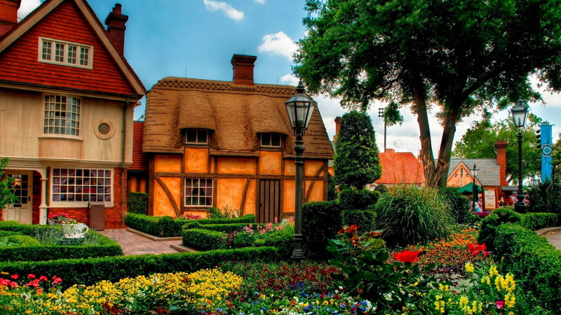 building, brown, house, sky, residential district, outdoors, day, built structure, garden, architecture, flower, flowerbed, growth, flowering plant, ornamental garden