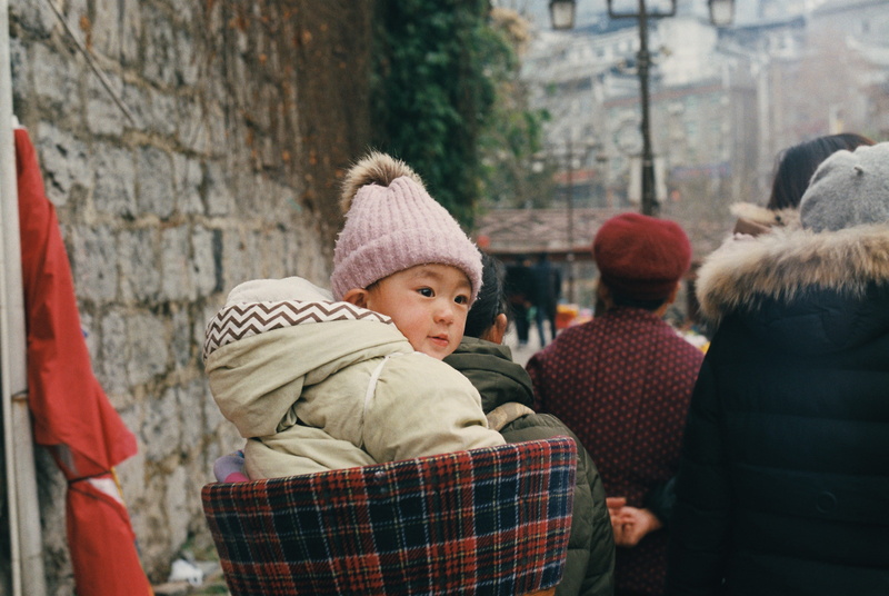 women, warm clothing, child, cold temperature, winter, rear view, positive emotion, real people, males, chinese, fenghuang, boys, clothing, childhood, day