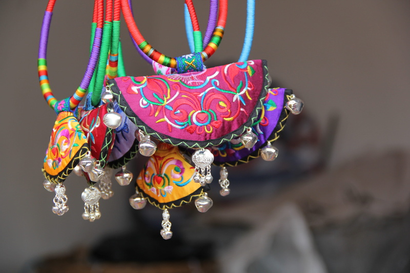 still life, regional, jewelry, souvenir, hanging, folk, focus on foreground, national characteristics, fenghuang, pattern, close-up, ornate, circle, no people