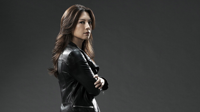 beauty, indoors, looking at camera, Agents, leather jacket, leather, beautiful woman, side view, three quarter length, gray background, 1080P, standing