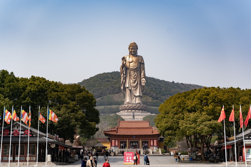 travel, nature, flag, statue, town, person, china, plant, building, the grand buddha, worship, travel destinations, human representation, tree, urban, temple
