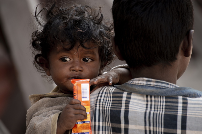 orange, bonding, childhood, portrait, boys, drink, person, food, finger, urban, innocence, family with one child, kathmandu, human, togetherness, care