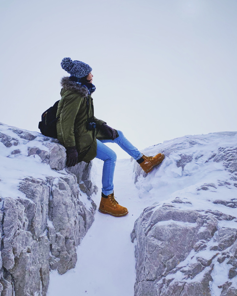 real people, covered, jacket, outdoors, woman, mountain range, boots, glacier, winter, hooded, peak, snowcapped mountain, blue, hiking, beauty in nature