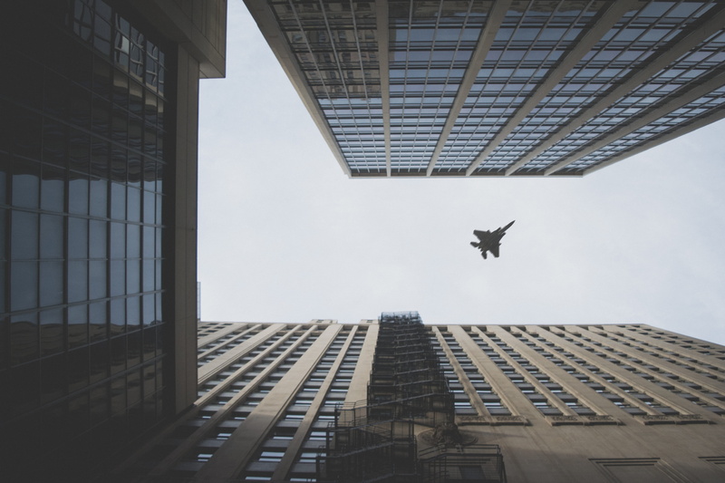 air, mid-air, doherty, air vehicle, no people, outdoors, building, flight, one animal, day, fighter, building exterior, 5K, facade, sky, city, worm, flynn