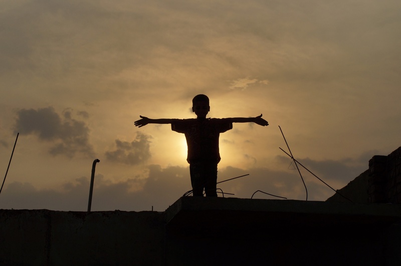 standing, cloud - sky, dusk, architecture, arms raised, sunrise, child, person, one person, hight, outstretched, people, gesturing, leisure activity, photo