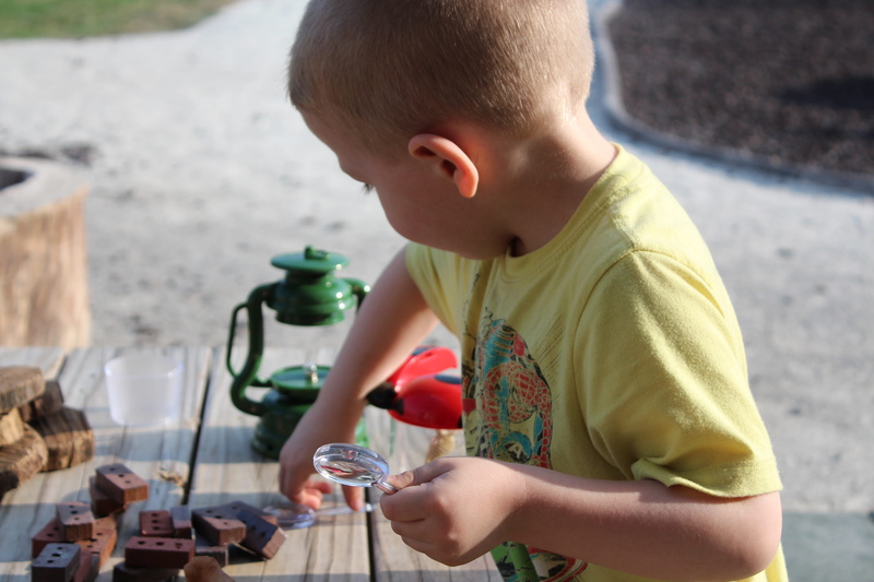 holding, one person, side view, science, beside, lifestyles, one boy only, drinking, day, outdoors, men, child, learning, real people, leisure activity