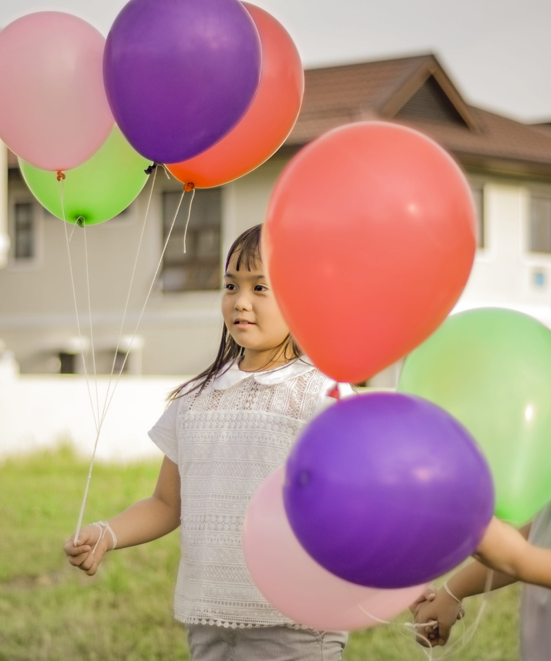 leisure activity, females, colourful, innocence, adorable, holding, fragility, one person, women, balloons, girl, face, real people, female, casual clothing