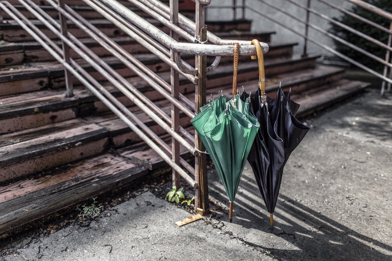 stairs, rain, urban, sunlight, chair, clothing, dry, stair, green, architecture, shadows, 5K, city, green color, railing, two, hanging, black, high angle view