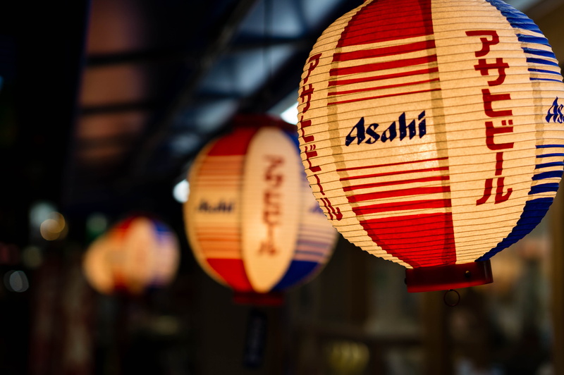 chinese lantern, photography, communication, dish, plate, lantern, outdoors, sphere, text, script, red, decoration, hanging, food, focus on foreground