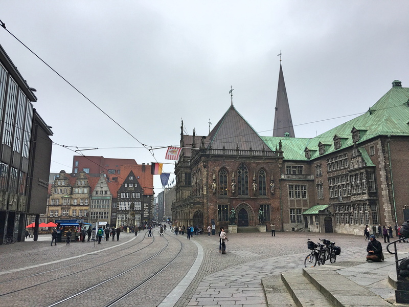 cable car, railroad track, marketplace, building exterior, built structure, transportation, upper street, rail transportation, incidental people, travel