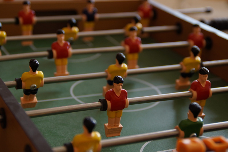 togetherness, play, photo, indoors, figurine, children, foosball table, sport, table, in a row, figures, human representation, team sport, toys, competition