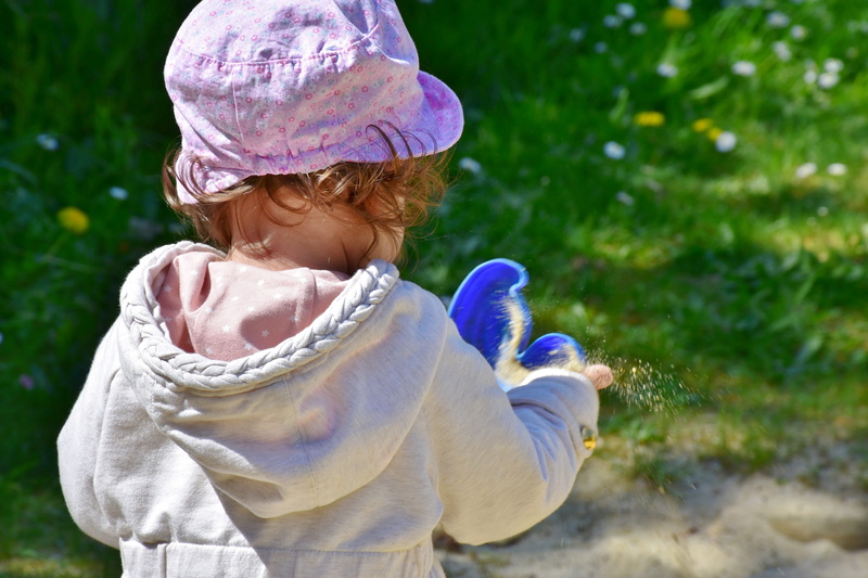 fun, waist up, lifestyles, vital, cap, toy, weather, holding, plant, female, toddler, girl, baby, meadow, beautiful, human, sand, flower, 5K, plastic