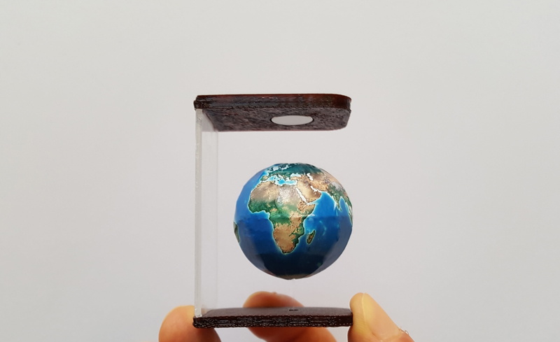 gravity, float360, Globe, digital composite, adult, news, case, cut out, floating, blue, planet earth, 2K, suspension, holding, mid-air, world at your fingertips
