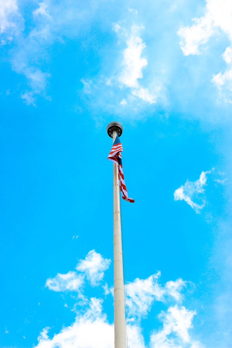 2K, communication, kuala lumpur, sky, architectural column, outdoors, statue, real people, human arm, day, tall - high, men, architecture, built structure
