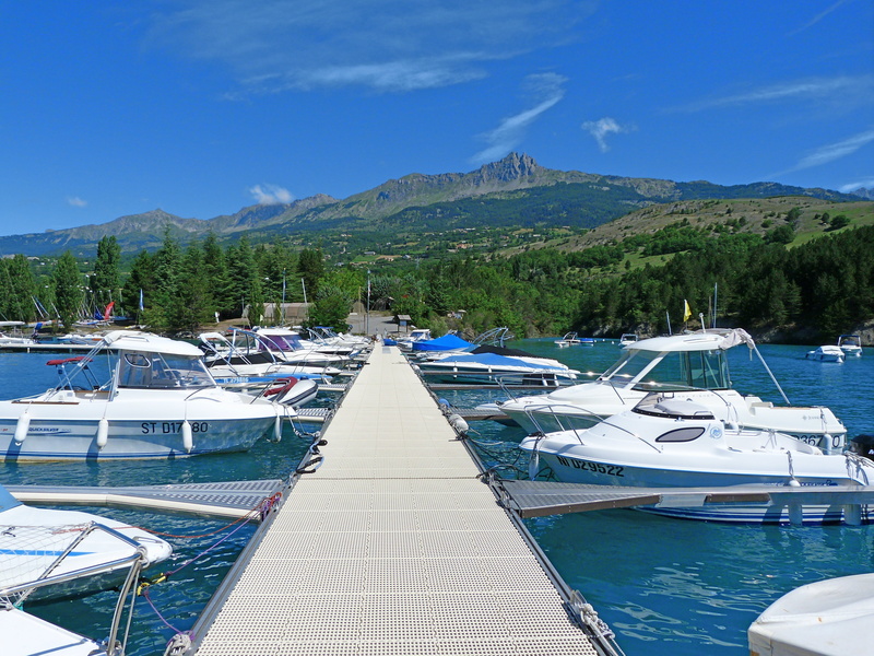 landscape, water, day, mountain range, tree, luxury, beauty in nature, blue, port, nature, no people, travel destinations, nautical base, nautical vessel