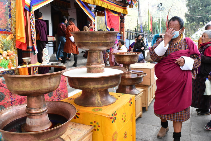 lifestyles, traditional clothing, women, real people, clothing, belief, praying, buddhism, adult, holy, temple - Building, men, spirituality, travel, bhutan