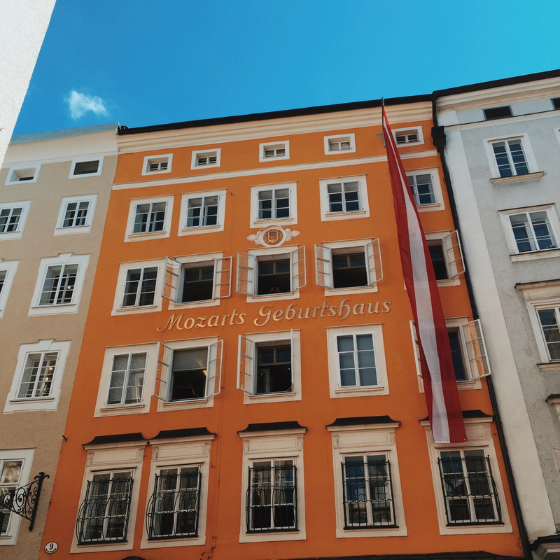 apartment, orange, flag, built structure, architecture, mozarts, glass - material, in a row, outdoors, nature, residential district, wall - building feature